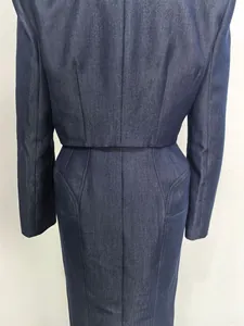 Detailed back view of navy blue denim skirt suit showing seam and fabric texture