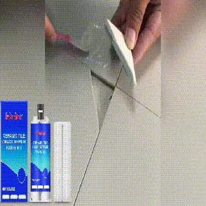 Detailed view of ceramic tile crack repair paste kit being applied to floor gaps