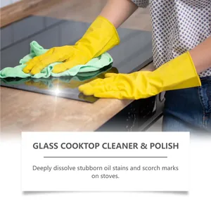 Close-up of cleaning a glass cooktop to remove stubborn oil stains and scorch marks.