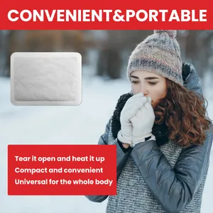 Patch chauffant jetable portable utilisé dans un paysage hivernal enneigé extérieur