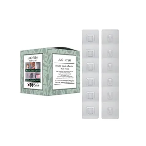 Close-up of Jue-Fish adhesive wall hooks and their informative English packaging box