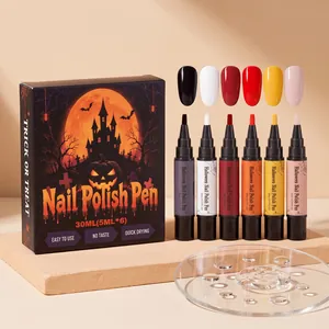 Set de lápices de esmalte de uñas Halloween con seis colores sobre base de piedra.