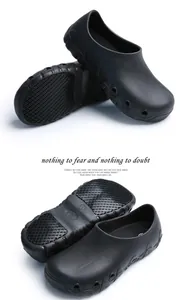 Detailed view of non-slip sole and waterproof material of black chef work shoes.