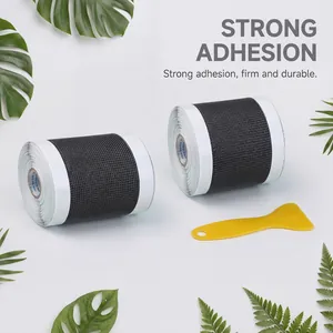 Detailed view of window screen repair tape rolls and yellow application scraper tool