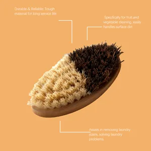 Detailed view of bamboo vegetable cleaning brush with dual bristles for effective dirt removal