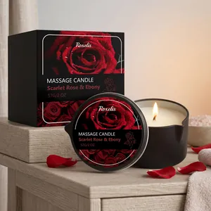 Professionelle Duftmassagekerze Rose in schwarzer Dose und Box mit brennender Flamme