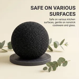 Detail shot of black porous cleaning sponge ball safe for nonstick cookware and glass