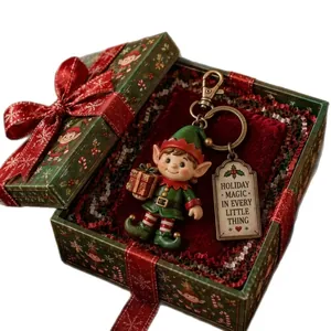 Festive Christmas elf keychain inside a decorative green and red holiday gift box