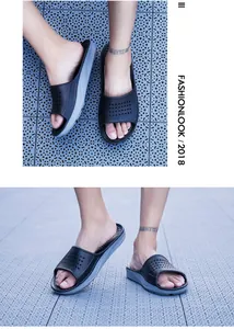 Macro detail of breathable dual-color non-slip slippers worn on textured flooring