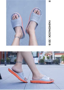 Detailed view of lightweight two-tone non-slip slides for indoor and outdoor summer use