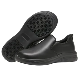 Detailed view of black slip-on work shoes with textured anti-slip rubber sole for chefs