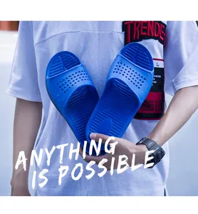 Detail view of blue lightweight anti-slip summer slippers arranged in a heart shape