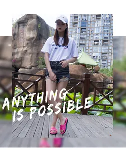 Model wearing pink non-slip slide slippers in an outdoor lifestyle setting with park background