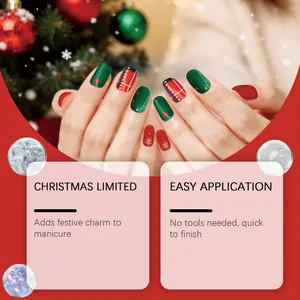 Detail view of Christmas themed soft gel nail stickers with festive red and green patterns