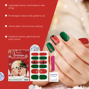 Detailed view of red and green Christmas soft gel nail stickers with accessories
