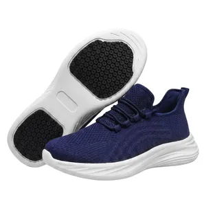 Detailed close-up of breathable blue chef shoes with white non-slip rubber soles