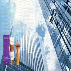 Detailed closeup of moisturizing BB cream set featuring application brush and purple box packaging.