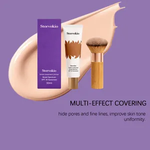 Full makeup set including tinted primer, moisturizer, and brush on a cream texture background