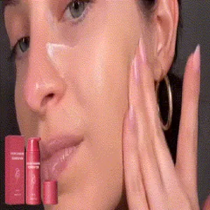 Close-up of color-changing foundation liquid applied to a model's face for a natural look.