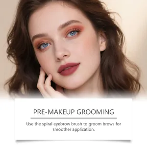 Model showcasing groomed natural eyebrows using a spiral brush for makeup preparation.