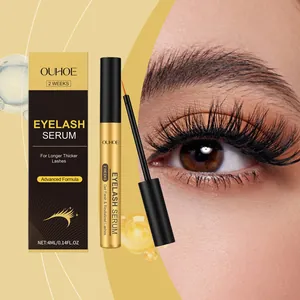 Close-up of OUHOE eyelash serum packaging and applicator next to long lashes effect