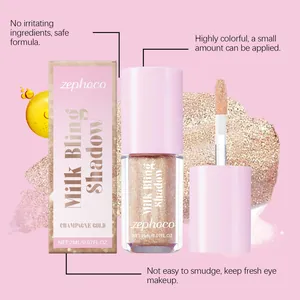 Detailed view of Zephoco champagne gold liquid glitter eyeshadow with brush and box.