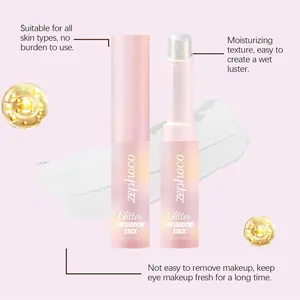 Detail view of a shimmering pink glitter eyeshadow stick with moisturizing texture.