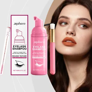 Close-up of pink eyelash shampoo foam cleanser with cleaning brush and mascara wand