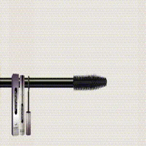 Close-up detail of black mascara wand, silver tube, and product packaging box.