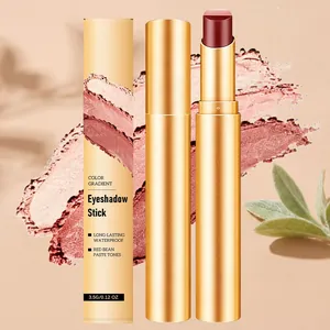 Nahaufnahme des goldenen Lidschattenstifts mit rotbraunem Farbton und Verpackung