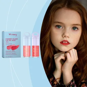 Detail view of Wiieey Cherry Glaze lip oil duo set with moisturizing tinted tubes for kids.
