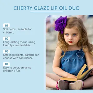 Detail view showing a child using the moisturizing and safe cherry glaze lip oil duo set.