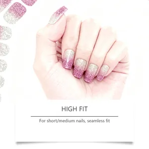 Close-up of pink and silver glitter gradient gel nail stickers for a seamless fit.