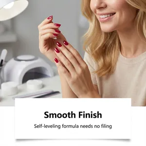 Close-up of berry red glossy nails showing a smooth, self-leveling finish