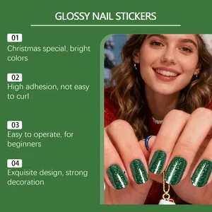Close-up detail of dark green glitter Christmas soft gel nail stickers for festive DIY manicures