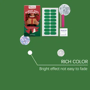 Close-up of Nymixa green glitter Christmas soft gel nail sticker DIY kit.