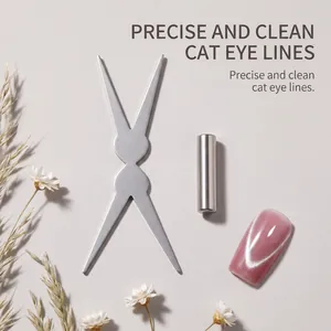 Close-up of double-ended cat eye nail magnet tool and cylindrical magnet for DIY manicures