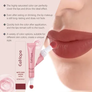 Close-up of matte rose red liquid lipstick applied on lips with product packaging