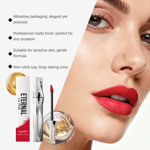 Close-up of bright red matte liquid lipstick with professional silver packaging