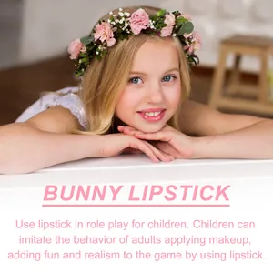 Close-up of a young girl wearing pink toy lipstick for children's role play