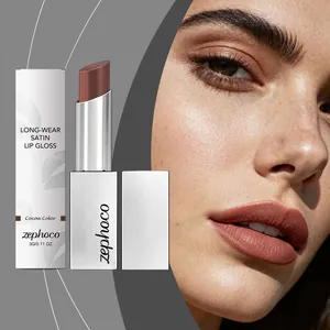 Close-up of model wearing Cocoa color satin lip gloss shown with product packaging