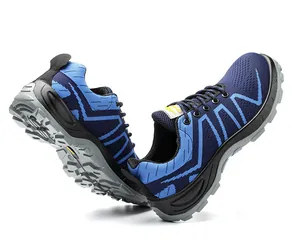 Detailed macro view showing the side design and anti-slip sole of blue flyknit safety shoes