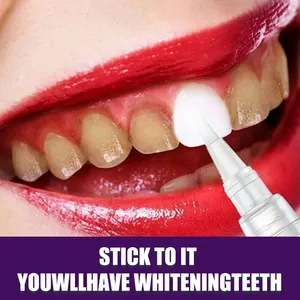 Close-up showing tooth whitening pen applying gel to brighten yellow stained teeth