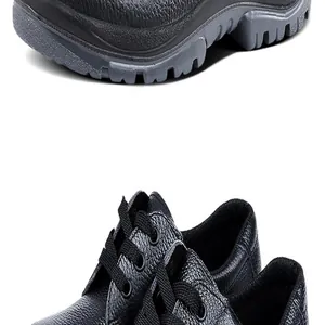 Dettaglio ravvicinato di scarpe antinfortunistiche nere con punta in acciaio e pelle