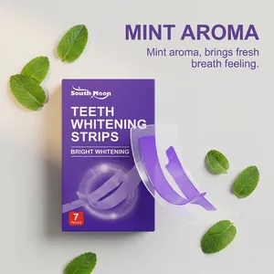 Close-up of South Moon purple teeth whitening strips with mint leaves for fresh breath