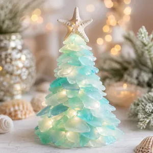 Elegante albero di Natale in vetro marino luminoso con stella marina e luci LED integrate.