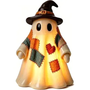 Detail of a light-up patchwork ghost figurine with a heart and wizard hat for Halloween