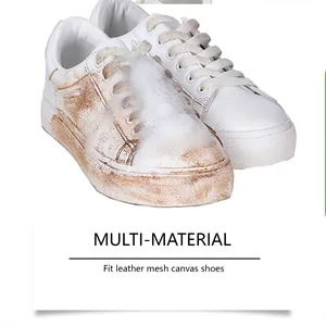 Close-up of white shoe foam cleaner removing dirt from leather and mesh sneakers.