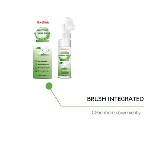 Close-up detail of white shoe cleaning foam with integrated brush head applicator