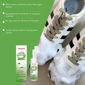White shoe cleaning foam being applied to dirty sneakers for deep stain removal.